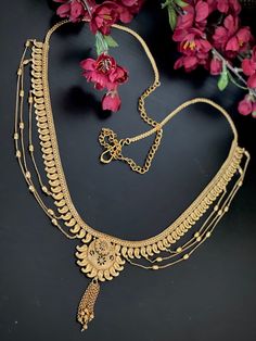 This Bollywood style Antique gold layered Kamarbandh is a perfect addition to your ethnic dresses! Measurements of the Hip chain : ---------------------------------- Length: 39 Inches  Jewelry  care: Avoid Contact With Perfumes, Sprays, Chemicals and Water. Keep your Jewellery in a Clean, Dry and Airtight Box. Wipe it using a Soft Cloth Regularly. Adjustable Gold Bohemian Chain Belt, Bohemian Gold Chain Belt With Adjustable Chain, Adjustable Bohemian Gold Chain Belt, Traditional Waist Chain With Latkans For Festive Occasions, Traditional Festive Waist Chain With Latkans, Bohemian Gold Chain Belt, Festive Waist Chain With Latkans For Festivals, Bohemian Gold Waist Chain For Festivals, Traditional Waist Chain With Latkans For Festivals