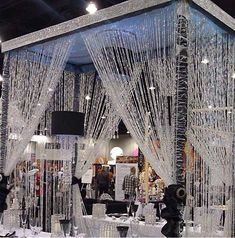 a white table topped with lots of tables covered in snow