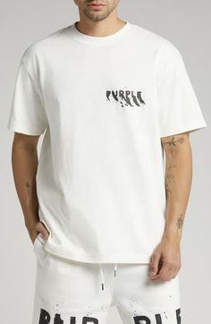 A cracked logo print brings vintage-inspired authenticity to a heavyweight cotton T-shirt cut in a slouchy, oversized fit. 29" length (size medium) Crewneck Short sleeves 100% cotton Machine wash, line dry Imported Asian Owned/Founded White Drop Shoulder T-shirt With Graphic Print, Cotton T-shirt With Logo And Drop Shoulder, White T-shirt With Graphic Print And Drop Shoulder, Cotton Drop Shoulder T-shirt With Logo, T Shirt Cut, Fabric Gift Bags, Cut Tshirt, Nordstrom Store, Fabric Gifts