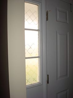 a white door with a glass window in it