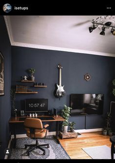 a living room filled with furniture and a flat screen tv on top of a wooden table