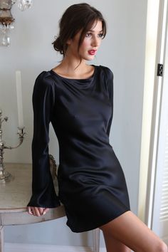 Slip on mini dress with long sleeves. Flattering for all shapes and sizes. Made of a pink polka dot silk. Satin Sheath Mini Dress For Evening, Elegant Satin Dress For Dinner, Sleek Long Sleeve Satin Evening Dress, Elegant Long Sleeve Mini Dress For Dinner, Elegant Black Silk Dress For Formal Occasions, Elegant Black Silk Formal Dress, Elegant Silk Party Dress, Silk Mini Dress For Evening, Silk Mini Evening Dress