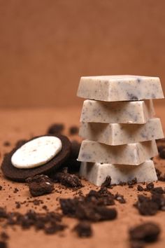 a stack of cookies and oreo pieces on top of chocolate chips