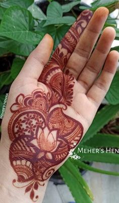 a hand that has a henna on it