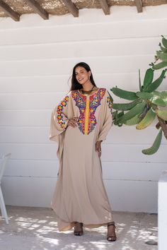 *Note : The kaftan in the video is a different color and is only displayed to show the fit, flow, and cut of the Kaftan. You will receive the one in the pictures.* A bohemian flash caftan made of light mesh of linen and poly, the fabric is unique in that it's very flowy and not the usual feel and touch of linen. This Kaftan is ideal to wear for any casual occasion. Whether taking a trip down the shopping lane, or home-based kitty parties, or about anything else, wearing this dress will make you Bohemian Kaftan For Festive Occasions, Bohemian Style Festival Abaya Floor-length, Bohemian Long Thobe For Eid, Bohemian Floor-length Abaya For Festival, Bohemian Festival Floor-length Abaya, Bohemian Floor-length Festival Abaya, Bohemian Thobe For Beach Eid, Bohemian Thobe For Beach And Eid, Bohemian Thobe For Beach Eid Celebration