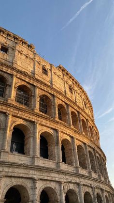 the roman colossion in rome, italy under a blue sky