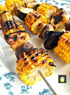 grilled corn and vegetable skewers on a plate