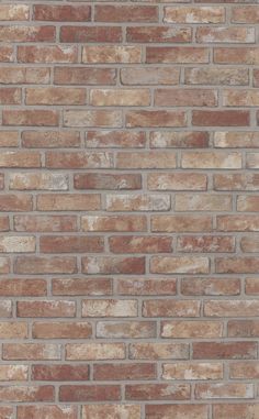 a brick wall that is made out of different colors and sizes, with no mortars