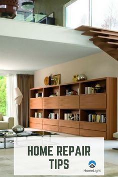 a living room filled with furniture next to a stair case