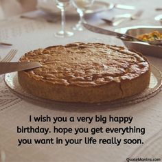 a cake sitting on top of a table with a knife and fork