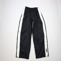 Vintage 90s Nike Mens XL Mini Swoosh Wide Leg Tearaway Pants Black Mens Pants Blemishes on white stripes Mens size XLarge Measurements are: 14.5 inches across the waist laid flat 33 inch inseam 44 inches from top to bottom 10.5 inch leg open Black Polyester US Shipping is FREE, Canada is $15 and International is $24 Check out my other items in my store! PR863 Tearaway Pants, Nike Hose, Black Pants Men, 90s Nike, Nike Vintage, Pants Vintage, Nike Mens, Pantalon Large, Black Vintage