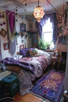 a bed room with a neatly made bed and lots of rugs on the floor