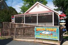 the sign for drum point market is displayed in front of a fenced off area