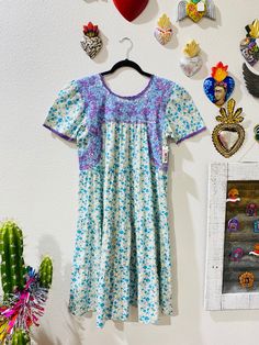 "Our San Antonino dresses are unique, beautiful and perfect for any fiesta, a day at the beach or a formal event. You can easily dress it up or dress it down. Our dresses are completely hand embroidered by Artisans in Oaxaca, Mexico. It takes approximately 1 month to complete one dress.  Our San Antonino dresses are one of a kind. You will fall in love with every single detail. Each dress is hand embroidered on front chest area, sides and back with tiny floral designs inspired by the flowers in Cinco De Mayo Cotton Dress With Floral Embroidery, Spring Fiesta Folk Style Embroidered Dress, Folk Style Fiesta Dress With Floral Embroidery, Multicolor Folk Embroidered Summer Dress, Traditional Cotton Embroidered Fiesta Dress, Fiesta Dress, Mexican Embroidered Dress, Mexican Dresses, Beautiful Color Combinations