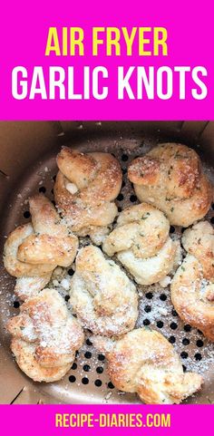 an air fryer with garlic knots in it and the words, air fryer garlic knots