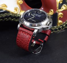 RECOMMENDATION FOR STRAP LENGTH : WRIST SIZE 15-17 CM - 115/75 MM STRAP LENGTH WRIST SIZE 17,5-19 CM - 130/80 MM STRAP LENGTHCaracteristics: Model : VINTAGE - BOX RED I Genuine BOX - CALF LEATHER Color : Red Handmade ONLY VALID FOR TANG BUCKLE (PHOTOS) Width : 26/24/22 mm (at the watch) - 26/24/22 mm (at the buckle) Length : 130 / 80 mm - 115 / 75 mm Thickness : aprox. 3,5 - 4 mm Edges : burnished - matte Keeper : 1 fix + 1 floating Inox. tubes included (Width 26 + 24 mm) Waterproofed: NO Logo s Red Watch With Adjustable Leather Strap, Red Leather Strap Watch Bands As Gift, Red Leather Strap For Watches, Red Adjustable Leather Strap For Watches, Classic Red Watch Bracelet Strap, Red Classic Adjustable Watch Bands, Classic Red Adjustable Watch Bands, Classic Red Watch Bands For Gift, Classic Red Watch Bands As Gift