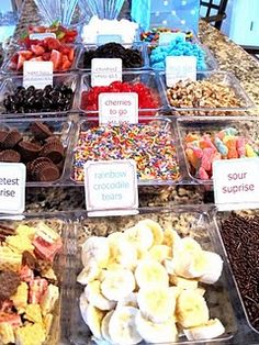 a table topped with lots of different types of desserts and candies next to each other