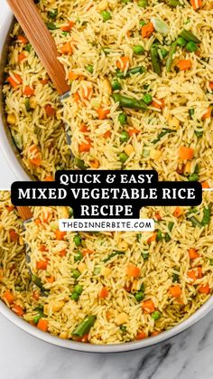 a bowl filled with rice and vegetables next to a wooden spoon