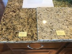 the counter top is covered in granite and has notes on it