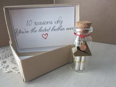 a message in a glass bottle next to a box with a corked card inside