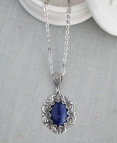 Lapis Lazuli Necklace. Cabochon measures 18x13mm. Pendant measures 32x25mm. Chained in nickel free silver plated chain. Closes with a lobster clasp. Length pictured is 18 inches long.  See the matching earrings here: https://www.etsy.com/your/shops/WearitoutJewelz/tools/listings/stats:true/675449046 Visit my shop today to see other great items. :) http://www.etsy.com/shop/WearitoutJewelz ♥ All items carefully packaged in a pretty gift box. Antique Silver Nickel Free Oval Necklace, Antique Silver Oval Nickel-free Necklace, Fandom Jewelry, Lapis Lazuli Necklace, Necklace Gemstone, Pillow Forms, Winter Clothing, Pretty Gift, Zipper Bags