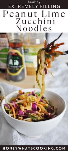 a white bowl filled with noodles and vegetables