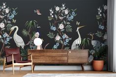 the wallpaper in this living room is decorated with birds and flowers