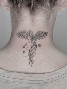 a woman's neck with a tattoo on the back of her neck, and an angel