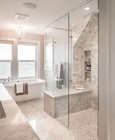 a large bathroom with a walk in shower next to a bathtub