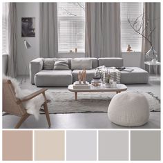 a living room filled with lots of furniture and decor in shades of gray, beige, and white