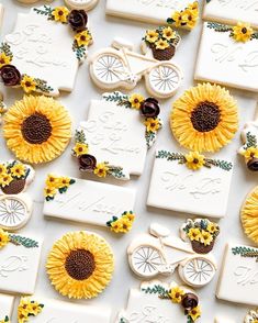 sunflowers and cookies are laid out on a white surface with the word love spelled in cursive