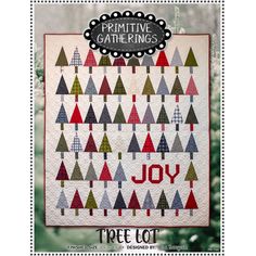 a christmas tree quilt with the words joy on it