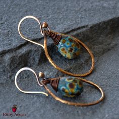 Fabulous and fun Turquoise Drops Earrings!  Gorgeous one-of-a-kind art for your ears made with artisan lampwork glass headpins and artisan antique brass finish wire rings, artisan antique brass finish ear wires.   Brimming with beauty and whimsy, truly a party for your eyes!  This is the only pair of earrings like this!  Rock your earlobes with these lovelies.  Express yourself with art you can wear!  These unique earrings are versatile, making them a must-have accessory.   Materials for Turquoi Handmade Teardrop Glass Jewelry, Adjustable Drop Earrings With Artistic Design, Bohemian Glass Drop Earrings, Artisan Teardrop Earrings With Artistic Design, Artsy Copper Drop Earrings, Unique Glass Earrings With Ear Wire, Adjustable Czech Glass Artistic Jewelry, Handmade Glass Bohemian Earrings, Bohemian Teardrop Jewelry With Artistic Design