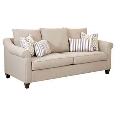 a beige couch with pillows on it