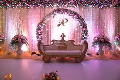 a decorated stage with flowers and candles