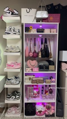 a closet filled with lots of shoes and handbags