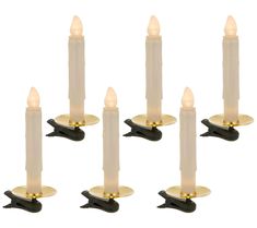 six candles with white frosting and gold trimmings on each candle holder, set of 6