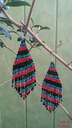 These handmade author's earrings are made of high-quality Czech beads and strong synthetic thread.In these unique earrings I use my author's scheme . Color: black,turquoise, green, purple, red, orange. I will make these earrings for you in your color. 100% hand made with love! Measurements: Length with hook -9,5 cm ( 3.74 inch ),Width -3 cm (1.18 inch) Materials: Silver plated ear hooks Czech glass beads Tytan Thread Unique Multicolor Beaded Earrings For Party, Handmade Multicolor Beaded Earrings For Party, Black Beaded Earrings With Colorful Beads For Gifts, Multicolor Beaded Earrings With Black Beads For Party, Multicolor Earrings With Black Beads For Gift, Traditional Black Beaded Earrings With Dangling Beads, Bohemian Multicolor Beaded Earrings With Black Beads, Unique Black Beaded Earrings With Dangling Beads, Unique Handmade Black Beaded Earrings