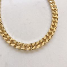 "Elevate the every day with this beautiful Statement thick gold chain necklace . Classic and super trendy for layering and for everyday wear. Materials: 14k gold plating over brass. Nickel free. Measurements: Chain length: 40cm (15\") +8cm(3\") extender chain. Chain thickness: 8 mm Shipping: Please allow 1-3 business days for your order to be processed and shipped. Gift: All orders are shipped in our customize box, gift ready. **Let me know if you have any questions at all and I will promptly re Gold Cuban Link Double Chain Necklace, Trendy Gold-plated Chunky Chain Necklace, Trendy Gold Plated Chain Link Necklace, Trendy Gold Cuban Link Necklaces, Trendy Gold Plated Chunky Chain Necklace, Trendy Gold Chain Necklace With Chunky Chain, Gold Cuban Link Necklace With Chunky Chain, Gold Chunky Chain Choker Necklace, Trendy Gold Curb Chain Necklace