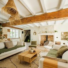 a living room filled with furniture and a fire place