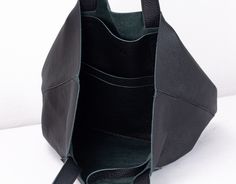 "The Calisto tote bag in Black soft pebbled cow leather. This unlined leather purse is a great tote and then some! With its simple yet fashionable design, it will carry all your daily essentials and is perfect for those weekend getaways or trips to the gym. Inside the bag, there is a set of two pockets measuring 8\" x 5\" (21 x 12 cm) and 8\" x 6\" (21 x 15 cm) and a key clip attached to a long leather strip. Aprox. dimensions: 13\" x 12.5\" x 5.5\" (33 x 32 x 14cm).Top opening 18.5\" (47cm).Str Everyday Work Bag, Simple Purse, Everyday Tote Bag, Market Tote Bag, Everyday Tote, Key Clip, Market Tote, Daily Essentials, Bag Shoulder