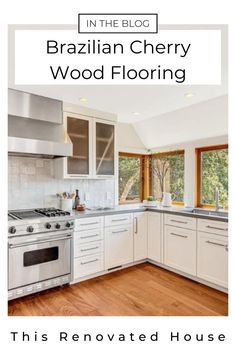 a kitchen with white cabinets and wood floors