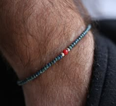 "-->> Let yourself be seduced by this minimalist and stunning adjustable beaded bracelet made up of tiny blue Japanese Miyuki beads, featuring a tiny red coral bead. -->> Neutral, minimalist and dainty, this casual bracelet may be a perfect gift for husband, boyfriend, friend, family member or coworker, on any occasion: birthday, anniversary, Christmas... -->> It will become your perfect everyday bracelet and, you can wear it alone or stacked with others.  -->> Details: *Gemstone:  oCoral bead odiameter: 4mm (0.16\") *Beads:  oMiyuki beads ocolor: blue odiameter: 3mm (0.12\") *Thread cord:  oSilk cord oavailable in different colors -> select the color of your choice *Bracelet length:  oadjustable with 2 sliding beads for closure -->> Pictures may vary slightly from the original bracelet du Seed Bead Bracelet For Men, Mens Beaded Bracelet, Men Beads Bracelet, Mens Seed Bead Bracelet For Men, Beaded Bracelet For Men, Mens Seed Bead Bracelet, Blue Beaded Bracelets With Adjustable Cord, Beaded Bracelets For Men, Bracelet Ideas For Men