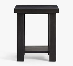 a small black table with one shelf on the bottom and two shelves below it, all in dark wood