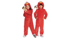 two children in red sesame costume standing next to each other