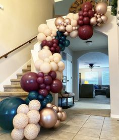 a staircase decorated with balloons and streamers