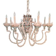 a chandelier with five lights hanging from it's center and four arms