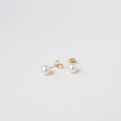 A simple clean white pearl post earring with a 14K gold post and earring back. Great on its own or layered with hold hoops or even other pearls. They make a great everyday staple that goes with almost everything. 14K Yellow Gold 6MM Pearl Stud Made in Rode Island, USA Minimalist Everyday Akoya Pearl Earrings, Minimalist Akoya Pearl Earrings For Everyday, Classic Everyday Akoya Pearl Earrings, Everyday Akoya Pearl Earrings, Minimalist 14k Gold White Pearl Earrings, Minimalist Yellow Gold Pearl Earrings For Everyday, Everyday Yellow Gold Pearl Earrings, Minimalist White Pearl Earrings In 14k Gold, Everyday Yellow Gold Round Pearl Earrings