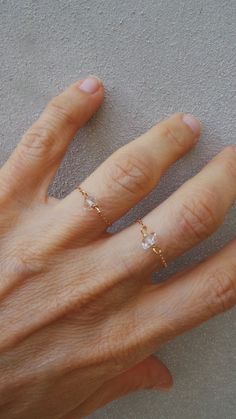 "Before placing an order please check the estimated shipping times. If you need your order in a hurry shipping upgrades are available. Thank you. This little chain ring is beautiful in its simplicity! D E T A I L S *It features a sparkly raw Herkimer diamond. * Herkimer diamonds are actually double terminated quartz crystals. The \"diamond\" in their name is due to both their clarity and natural faceting. *That has been wire wrapped using gold fill wire to a 14k gold filled chain that is surpris Delicate Tiny Toe Ring Jewelry, Delicate Toe Ring Jewelry, Dainty Toe Ring Jewelry For Promise, Dainty Rose Gold Promise Ring Jewelry, Rose Gold Dainty Jewelry For Promise, Dainty Midi Rings For Promise With Diamond Cut, Dainty Crystal Open Ring With Rose Cut Diamonds, Minimalist Faceted Promise Ring, Delicate Crystal Ring With Rose Cut Diamonds For Gift