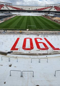 an empty soccer stadium with the word aob painted on the field and in front of it